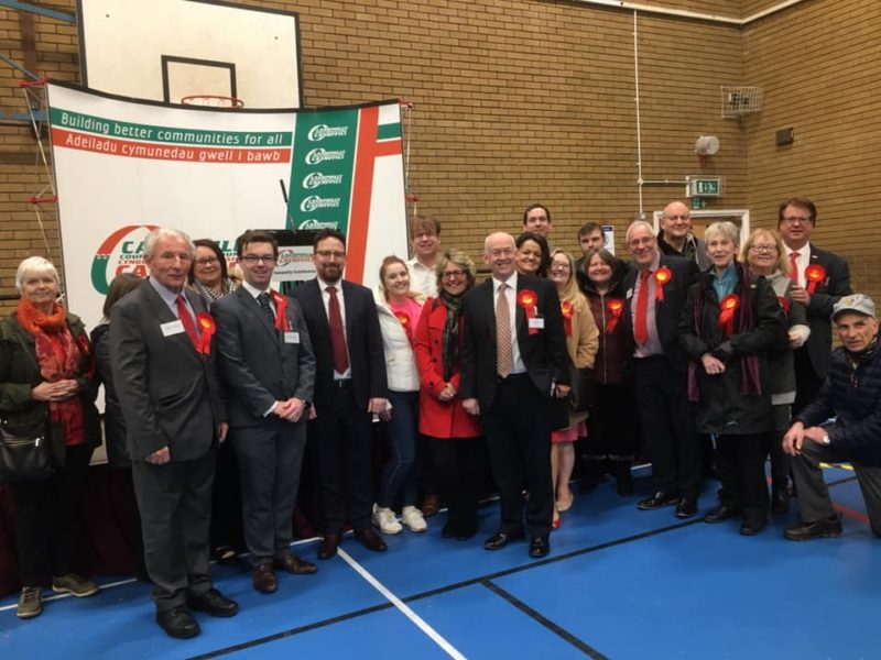 Wayne David and local Labour members and supporters after the result for the election in Caerphilly was announced